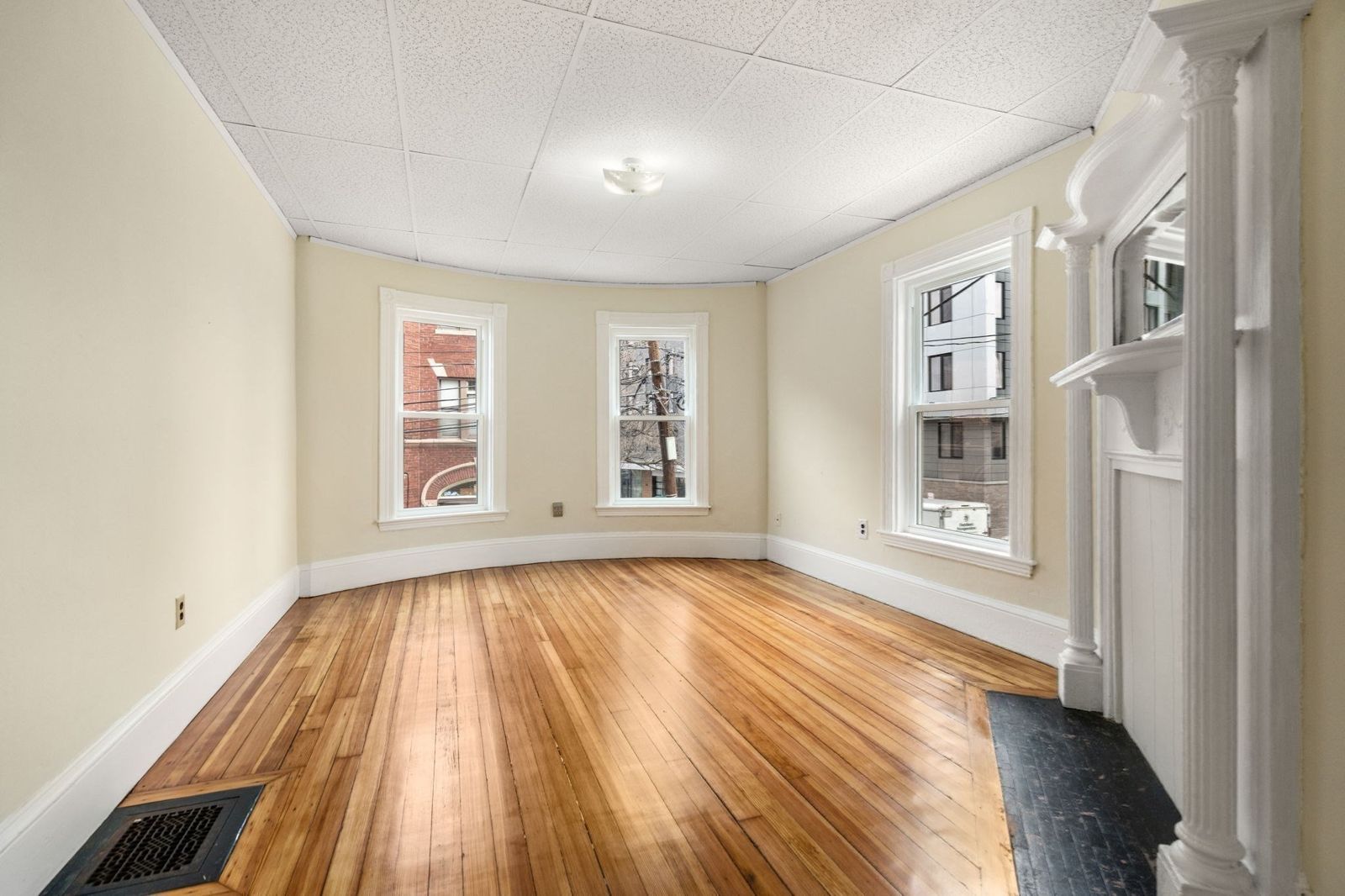 Living room with a fireplace and hardwood floor